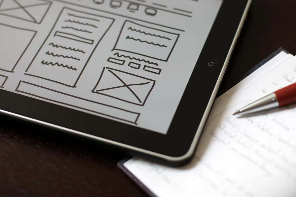 An iPad with wireframes on it, one of the many tasks of UX designers.