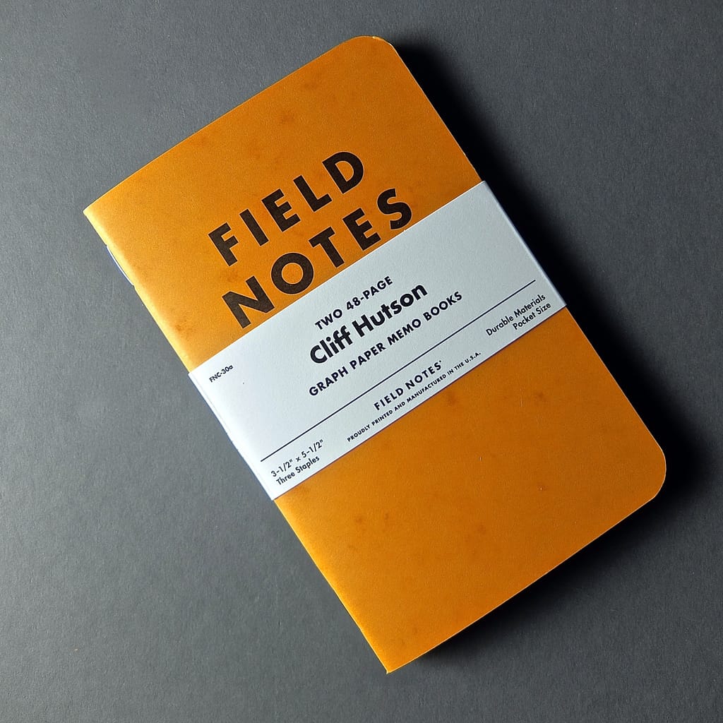 Image of a field notes graph paper memo book notebook orange.