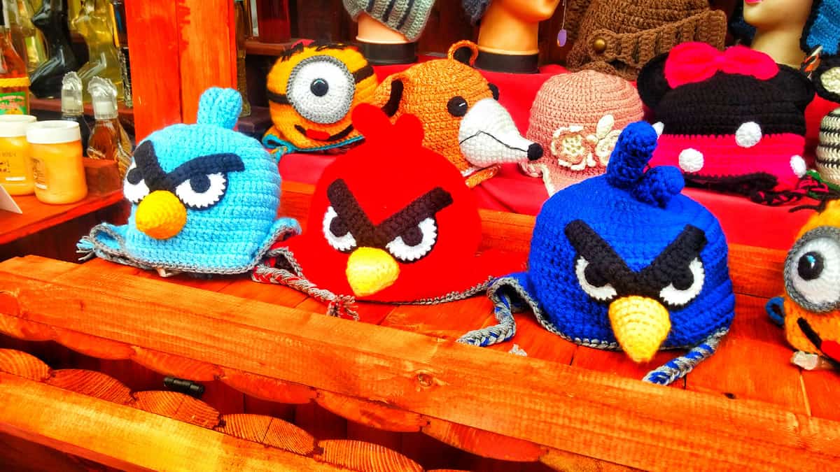 A photo of crocheted Angry Birds hats on display in a store.