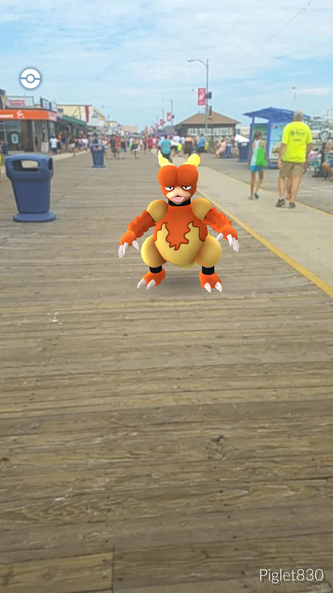 A screenshot of a Pokémon GO character standing on a boardwalk.