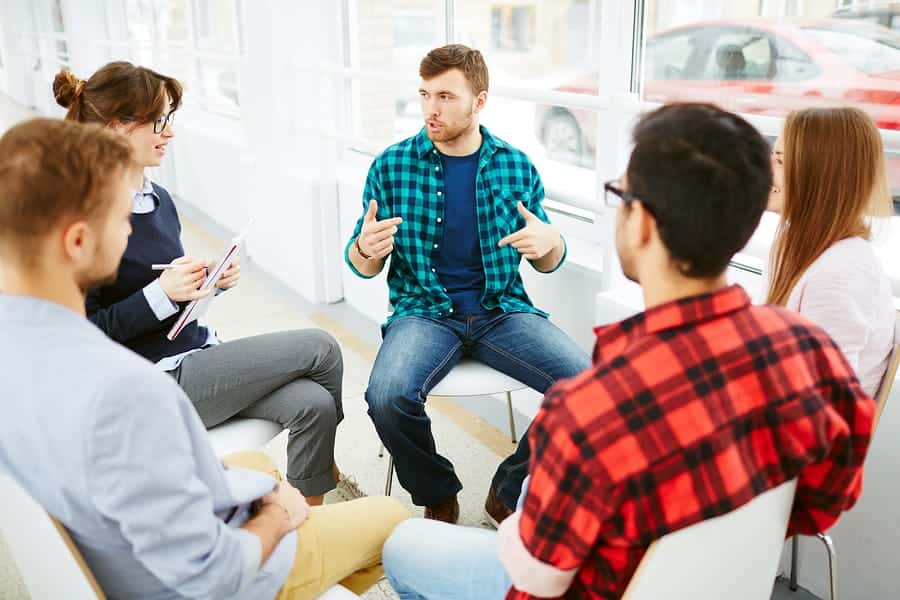 A photo of a small group therapy session.